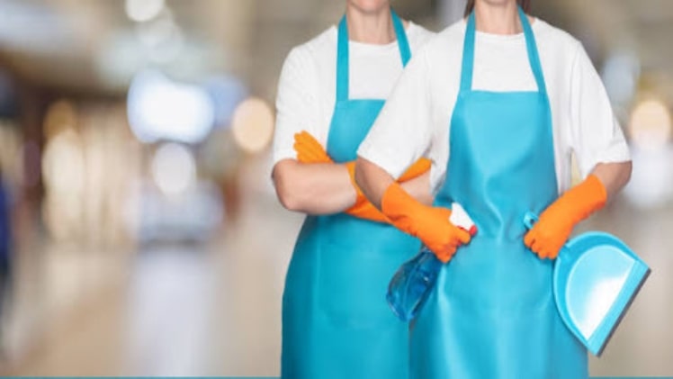 female workers on a blue rubber apron